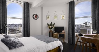 The three boutique guest rooms feature a combination of midcentury furniture and playful, spirit-inspired accents. Designed by the brand’s founding directors, each room includes a minibar filled with spirits that have been crafted on-site, as well as a bespoke record player with a vinyl playlist that’s been curated by Rough Trade Records.