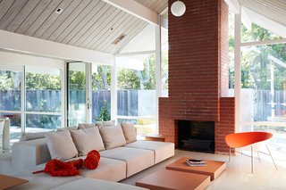 Same Bones, New Materials—A Double Gable Eichler Gets a Dashing Update - Photo 4 of 9 - In order to open up the space, Klopf Architecture took out a few walls that were supporting overhead beams. Klopf explained, "We used the structural trick of putting a supportive cross-beam on the roof, which you don’t see. The ceiling now has an open, more expansive feeling—it's more post-and-beam." 