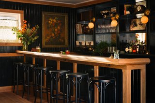 The lobby, which doubles as a lounge, is designed to feel like a cozy, classic parlor. The oak millwork is custom and features brass and Carrara marble details. 