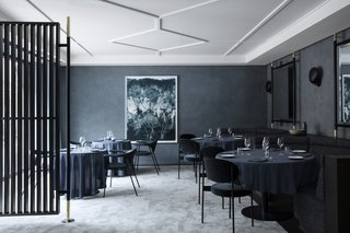 The Revived Maison du Danemark Brings Two New Danish Restaurants to Paris - Photo 8 of 9 - Unlike Flora Danica, Copenhague is draped in darker, more intense colors and textures. The walls are lined with GUBI’s Cobra Lamps while the large-scale mirrors come from the same design concept as their TS Collection.
