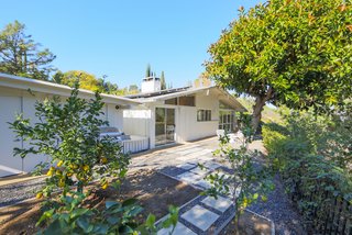 At the Matson Residence, a side yard allows the current homeowners’ daughter to play outside without them having to worry about the pool. 