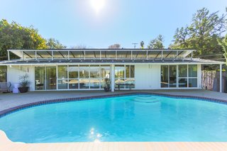 One of the past homeowners installed a large amount of solar panels on the roof of the house, which are fully paid off—so much that they actually generate more electricity than the house uses each month. The remaining funds don’t go to waste, but are dropped into a city account that the next homeowner can pull from when desired. 