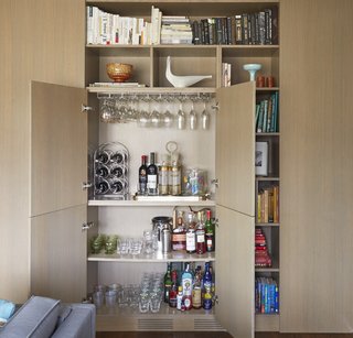 By stealing 15 inches from the kitchen, they were able to add a dry bar to the living room side of the space. The two first decided to do this over beers and trace paper in their favorite local bar. 
