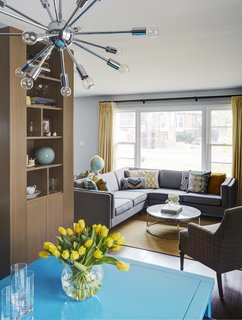 From the dining room, you can see the connected living room and a section of the custom storage wall that's made out a white oak veneer. 