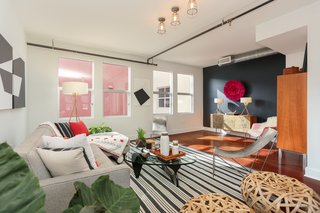 When Desbiens moved into the loft, she had Brazilian Cherrywood flooring stalled. The connected kitchen (seen in the hero image) featured stainless-steel appliances and fruitwood cabinetry. 