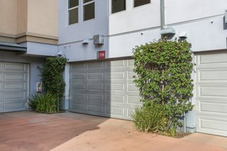 The steel-framed home sits behind an industrial roll-up door and has its own two-car garage in the back of the unit. 