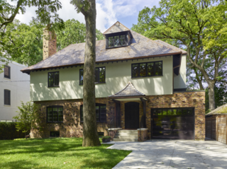 They were able to install a new integrated garage into the front while still preserving the historic facade's character. 