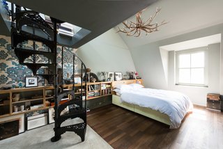 Formerly Home to an Artist and Knitwear Designer, a Commercial Space-Turned-Dwelling Hits the Market - Photo 6 of 10 - The whole third floor is dedicated to a double-height master bedroom, which contains its own set of original wrought-iron spiral stairs. 