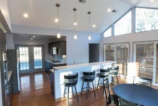 Along with exterior sunscreens, they installed interior shades that can be lowered for privacy and protection from the sun when desired. 