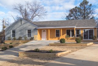 One of the main obstacles of the original house was that there were several steps that led up to the front door, which made it difficult for someone in a wheelchair to access it. The final renovated house (shown here) now has a smooth, sloped driveway that eliminates the need for steps. 