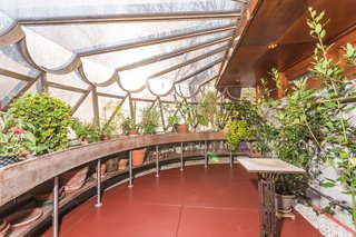 The greenhouse features windows that are finished with a scalloped metal treatment. Gricar points out that the metal scalloping can also be found on the Guggenheim—solidifying a connection to the other project that was on Wright's mind at the time.