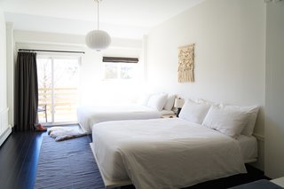 A Modern Mountain Lodge That Will Make You Love Winter Like Never Before - Photo 3 of 13 - The 12 different room types are furnished with pieces designed by Fort Standard, Fern, Samuel Moyer Furniture, and Vermont Farm Table. You’ll also find wall art—including photography and hand-woven tapestries—by Emily Johnston and The Catskill Kiwi.