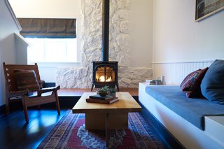 A Modern Mountain Lodge That Will Make You Love Winter Like Never Before - Photo 6 of 13 - In order to preserve the structural quirks throughout the property, many rooms boast high-peaked ceilings, lofted areas, and sleeping spaces. Many rooms also have their own fireplace or cast-iron stove.