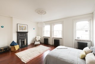 Among the five bedrooms is a master suite in the eaves that has an en-suite bathroom, freestanding bath, and a dressing area complete with under-eaves storage.