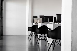 The space is also filled with Herman Miller’s all-black edition of the Eames Molded Fiberglass Armchair.
