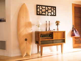 Indoek’s New Book Shares a Glimpse Into the Homes of Creative Surfers - Photo 10 of 11 - Russell Brownley (a director and DP of surf films) and Brianna Brownley (a footwear designer for Reef) call Carlsbad, California, home, where they live with their newborn daughter, Magnolia. When looking for the right home base, they searched for a place that was unique and full of character, and immediately fell in love with this house that has an open-beamed ceiling.