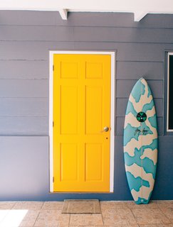 Indoek’s New Book Shares a Glimpse Into the Homes of Creative Surfers - Photo 6 of 11 - Known as the "unofficial ambassador of Tahiti," Raimana Van Bastolaer lives in a beach house right on the water in Papara on the south side of Tahiti. The bright details found throughout his home perfectly represent the personality that everyone in the surf industry calls up when they're looking for a good time in Tahiti.