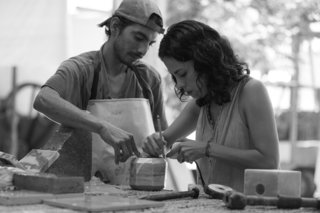 Caterina Moretti, Peca’s head designer and studio director, is shown here working closely with a marble object.