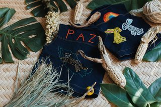 They produce little denim vests for kids that are handmade with a traditional embroidery process in Zinacantán in Chiapas, México.