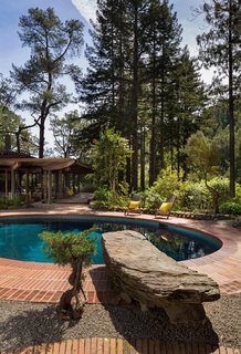 A huge rock that Liebermann picked out himself acts as a diving board into the pool. Liebermann's design allows the house to reflect in the pool when you first walk in through the front gate. The reflection doubles the size of the house. 