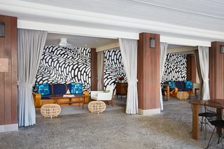 Art and Design Come Together in These 10 Examples of Inspirational Wall Murals - Photo 7 of 12 - In addition to the space being filled with furnishings, lighting, and artwork by a range of local designers, every little detail was thoroughly thought out and branded to fit seamlessly with the Surfjack ethos. Shown here is the hand-painted mural by Brendan "The Blog" Monroe.