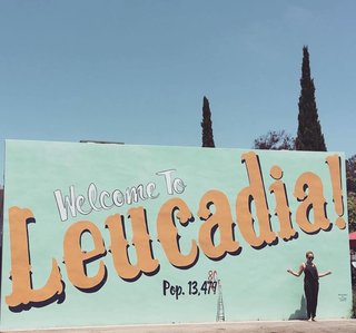 A New Modern Hotel in San Diego Offers Surfing Adventures and Local Hospitality - Photo 1 of 10 - A "Welcome to Leucadia!" sign leads visitors with open arms onto the quaint block where Surfhouse sits. It borders a community coffee joint called Coffee Coffee, as well as Surfy Surfy, an old-school surf shop that began as a surf blog in 2005 where JP St Pierre documented his family surfboard factory called Moonlight Glassing. In 2010, Pierre teamed up with a few of his surf buddies to open up Surfy Surfy, which is the same group that later opened up Coffee Coffee. Both destinations were part of a community effort to make sure local businesses continue to rule there.