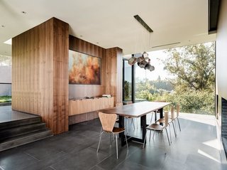 Custom walnut panels by GL Veneer have been incorporated in the dining room.