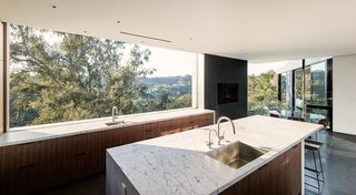 In the kitchen, a large window presents unobstructed canyon views.