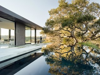 A smaller section of the house was placed alongside the pool as a pavilion. "It was important on this site to make it feel like nature was coming first, and the house second," says the firm's founder, Noah Walker, who thinks of design as a spiraling process. "In this case, the initial concept was strong, so the design was more a case of a series of progressive refinements."