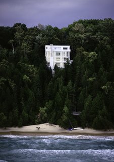 Richard Meier's 1973 Douglas House Receives Historic Designation - Photo 1 of 4 - Nestled into a steeply sloped waterfront site on Lake Michigan, the all-white, starkly modernist home is defined by verticality. 