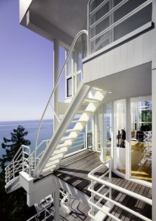 Richard Meier's 1973 Douglas House Receives Historic Designation - Photo 2 of 4 - A series of ladders and cantilevered staircases connect each level of home from the exterior, offering a dramatic cascading promenade with an expansive view of Lake Michigan.