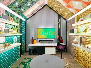 Each listening station features different simulated home environments—a kitchen and living room, for example—paired with unique interior elements. This one features custom wall coverings by artist Mark Chamberlain.