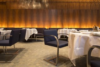 The Grill Room featured cantilevered Brno chairs by Ludwig Mies van der Rohe and banquettes by Philip Johnson, who was known to dine at his preferred seat, at table 32.