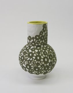 Ceramicist Bari Ziperstein Teams With Rachel Comey for a Sartorial New Collection - Photo 2 of 3 - Coated with an olive green, circular graphic, Ziperstein's vessel reinterprets a dress overlaid with a similarly patterned chain-metal mesh, from Comey's spring/summer 2017 collection.