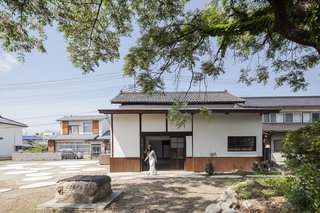 In an agricultural town in Japan's Yamanashi prefecture, a derelict sake warehouse was salvaged by the people of the town and turned into a community venue with an interior stage for meetings and performances.