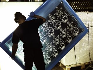 Nearly all artwork first undergoes a screen printing process at Marimekko's printing factory in Helsinki. At this stage, patterns are separated by color, then translated onto screens that will print each section of the fabric.