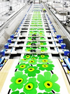 Once the screen printed graphic is finalized and approved by the creative and production teams, the pattern is printed onto cotton fabrics using long flatbed machines.