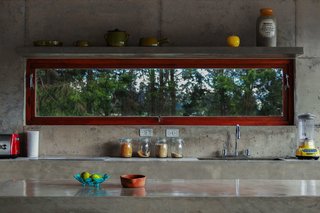 Poured by hand on site, nearly the entire structure of the El Quinche House—including the kitchen counters and sinks—was made of concrete sourced from a local quarry.