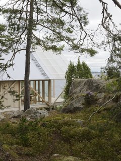 On Viggsö, an island of the Swedish Archipelago, architecture firm Arrhov Frick designed a two-story retreat, using simple but hardy materials. The timber frame is made of pine; the roof is made of corrugated metal and fiber-reinforced plastic.