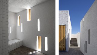 A series of narrow, vertical window openings punctuate the thick-walled facade of the structure, which is optimized for passive solar gains (left). A consistent application of surface materials throughout the interior and courtyard bridge the connection between indoors and out (right).