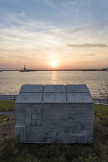 New York's Newest Park Sits on Recycled Demolition Debris - Photo 3 of 5 - The landscape will serve as a platform for public art, featuring British artist Rachel Whiteread's site-specific work <i>Cabin</i>, an otherworldly architectural installation on the tip of Discovery Hill. Made of concrete, the piece was cast from the wood interior of a New England–style shed.