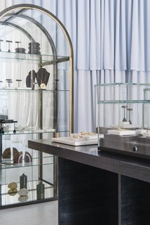 A vintage 1970s mirrored case by the Design Institute of America displays select treasures on the back wall of the shop. 
