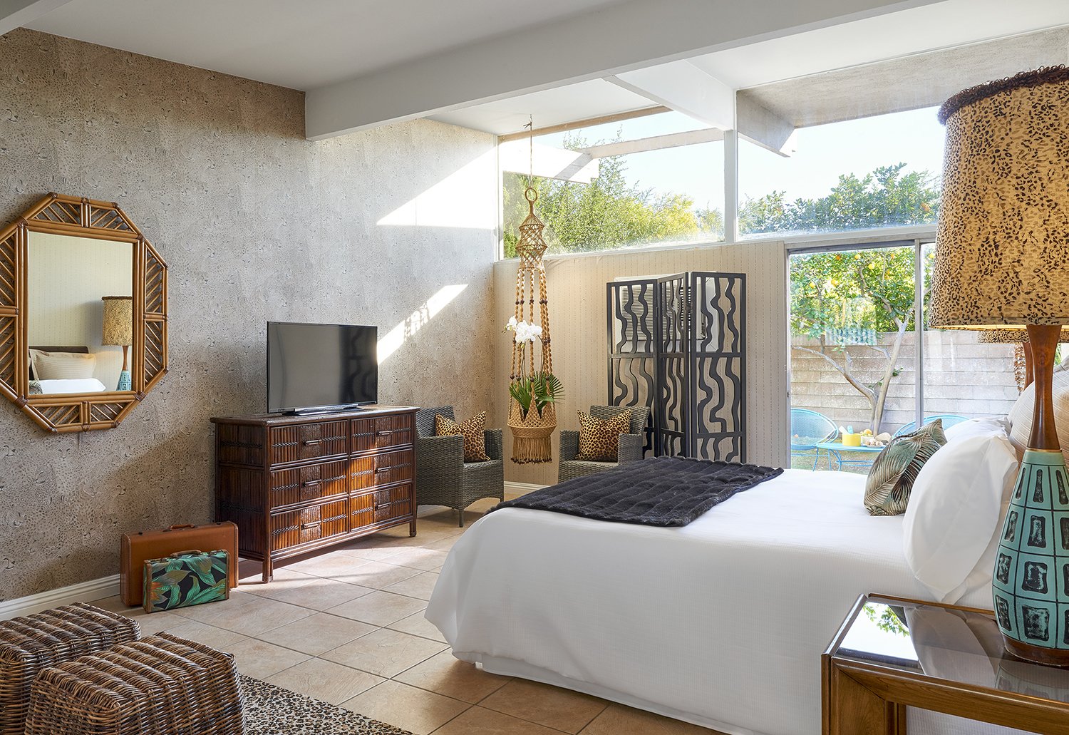 The new hotel's Jungle bedroom, stocked with finds from places like The Estate Sale Company, where it's not unusual to find treasures from the Parker Palm Springs, located just across the street. Other scores came from the now-shuttered Lot 58 auction house.
