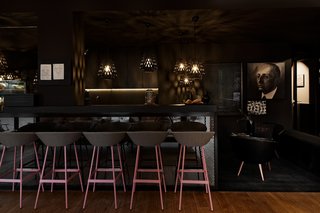 Inspired by the Sharing Economy, This Frankfurt Hotel Feels Just Like Home - Photo 5 of 7 - The bar at Libertine Lindenberg features a dark and moody color palette.