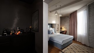 Inspired by the Sharing Economy, This Frankfurt Hotel Feels Just Like Home - Photo 1 of 7 - The interiors, designed by Studio Kathi Kaeppel, exhibit a dramatic contrast of light and shadow. All of the furnishings were manufactured in both pastel and black versions. 