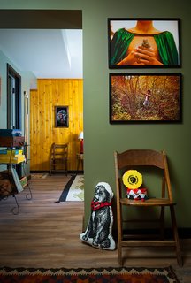 Art and games throughout the space invoke camp memories. Much of the art and accessories, like the photographs above, come from the Camp Wandawega Land of Nod collaboration. 