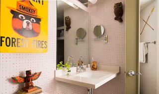 Kitschy references to camp culture, like this warning from Smokey the Bear, can be found throughout the space, but its amenities are all grown up, including Malin + Goetz toiletries.