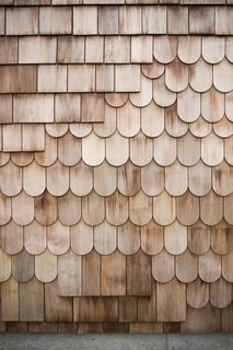 Boards, Battens, and Bevels: Wood Board Siding Types and Their Uses - Photo 8 of 9 - "Fancy cut" shingles are less common but equally effective in protecting interiors from the elements.