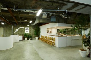 A Surprise Hides in this Tokyo Parking Garage - Photo 2 of 6 - A cafe and record shop welcome visitors to the first level on the subterranean shopping experience Park-Ing Ginza.