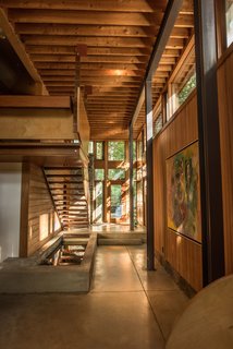 The new spaces recall the original design with their use of natural materials like wood and stone.